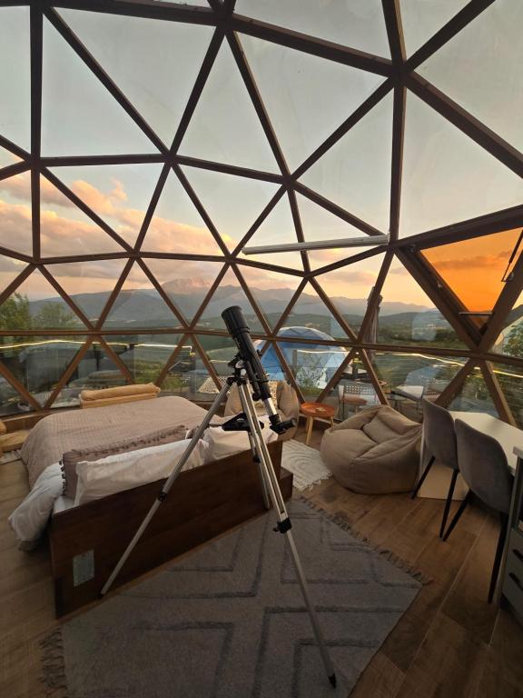 a room with a camera in a glass pyramid at Bubble Sky Villas Kosove in Ferizaj