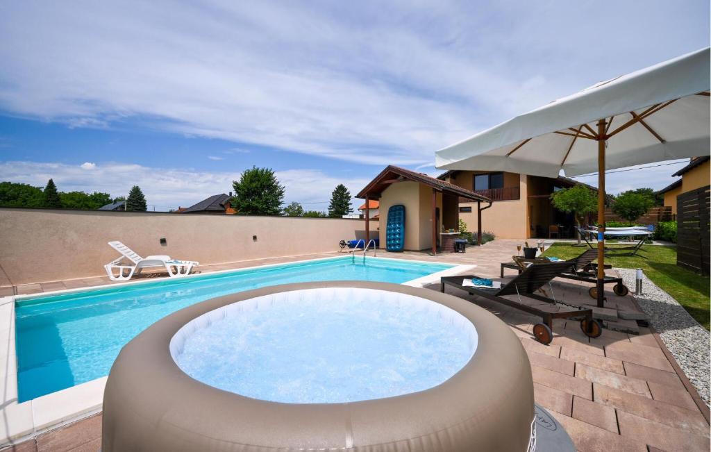 a swimming pool with a large swimming poolvisor at Lovely Home In Beretinec With Sauna in Beretinec