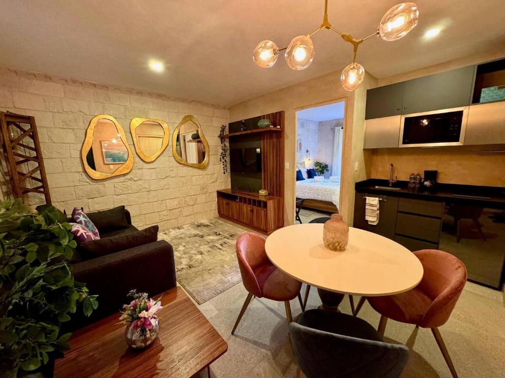 a living room with a table and a couch at Mueganos 1 en ValQuirico in Santeagueda
