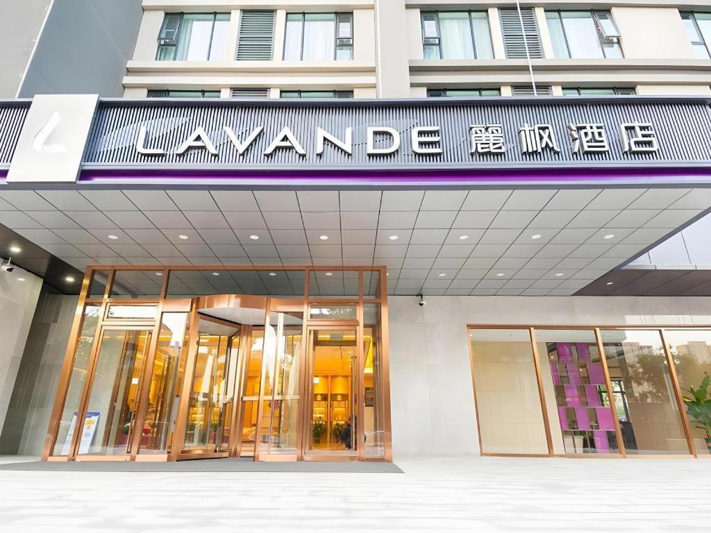 a building with a sign on the front of it at Lavande Hotel Beijing Fangshan Changyang Metro Station in Beijing