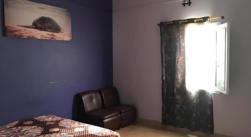 Ένα ή περισσότερα κρεβάτια σε δωμάτιο στο Nomads Beach Resort