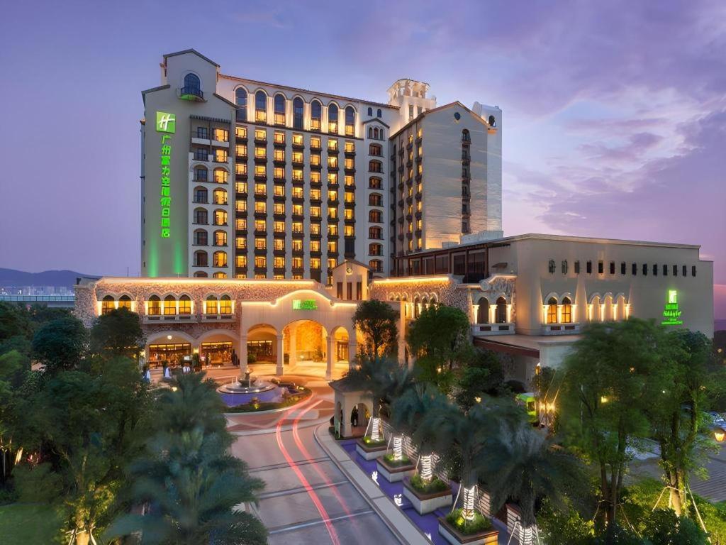 a large building with a street in front of it at Holiday Inn Guangzhou Airport Zone By IHG in Huadu