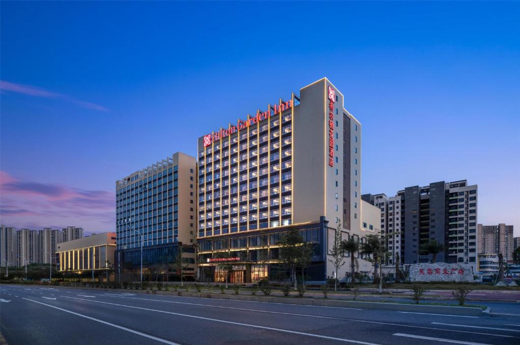 a rendering of a building on the side of a road at Hilton Garden Inn Shaoguan Furong New Town in Shaoguan