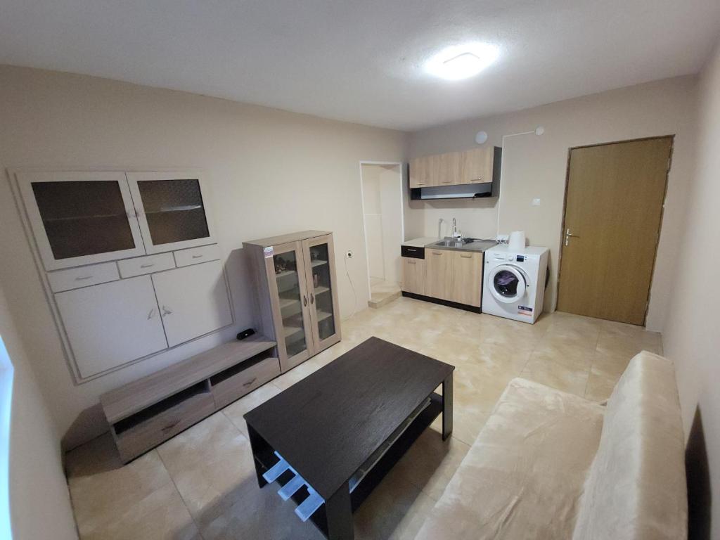 Η κουζίνα ή μικρή κουζίνα στο Calipsso Apartment's