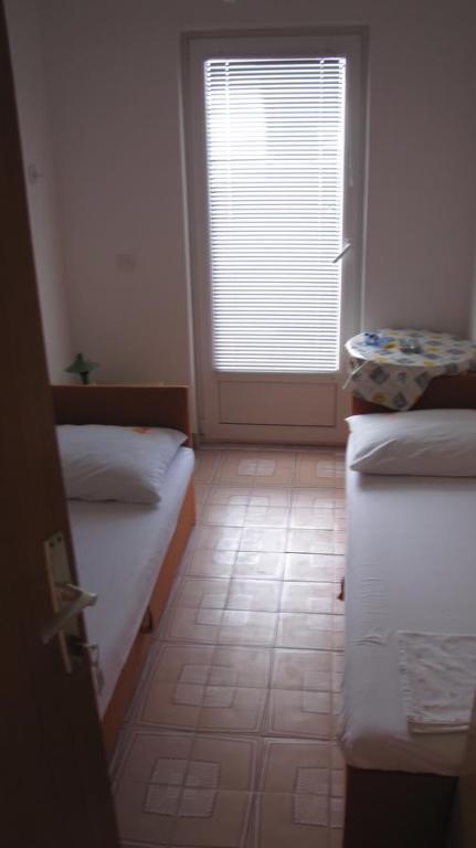 Postel nebo postele na pokoji v ubytování Apartments Primorac Podaca