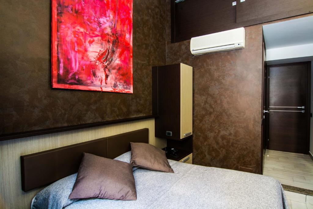 Postel nebo postele na pokoji v ubytování Hotel Charter