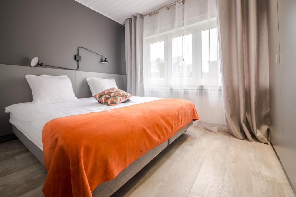 Postel nebo postele na pokoji v ubytování Mandarina Hotel Luxembourg Strassen