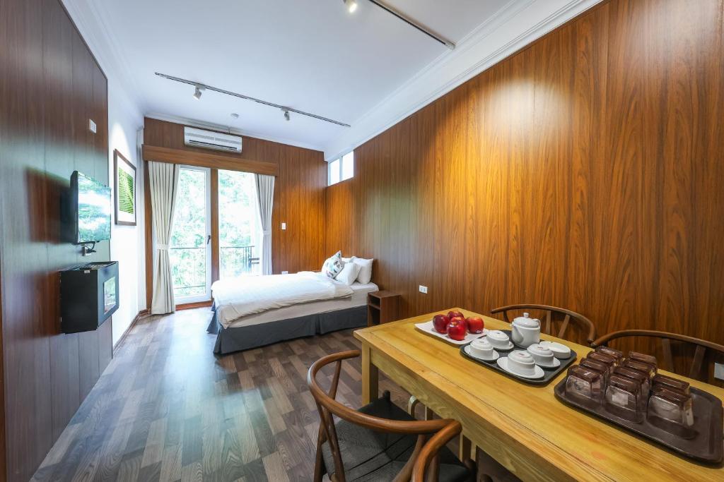 Giường trong phòng chung tại An Huy Apartment