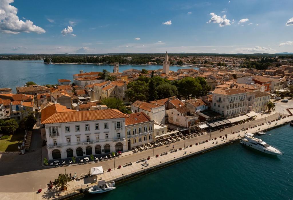 an aerial view of a city next to the water at Jadran Heritage Hotel, Valamar Collection in Poreč