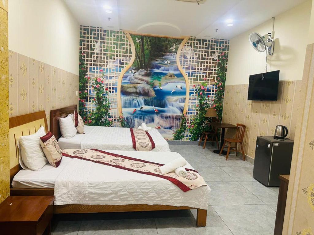 Postel nebo postele na pokoji v ubytování Dũng India Hotel