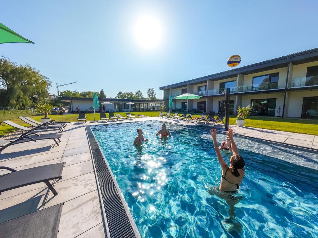 a group of people playing basketball in a swimming pool at Beach Arena Csopak in Csopak