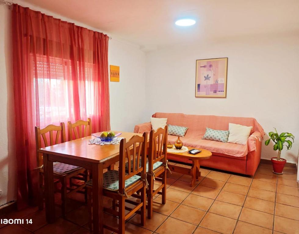 a living room with a table and a couch at Casa Indalo Mojácar in Mojácar