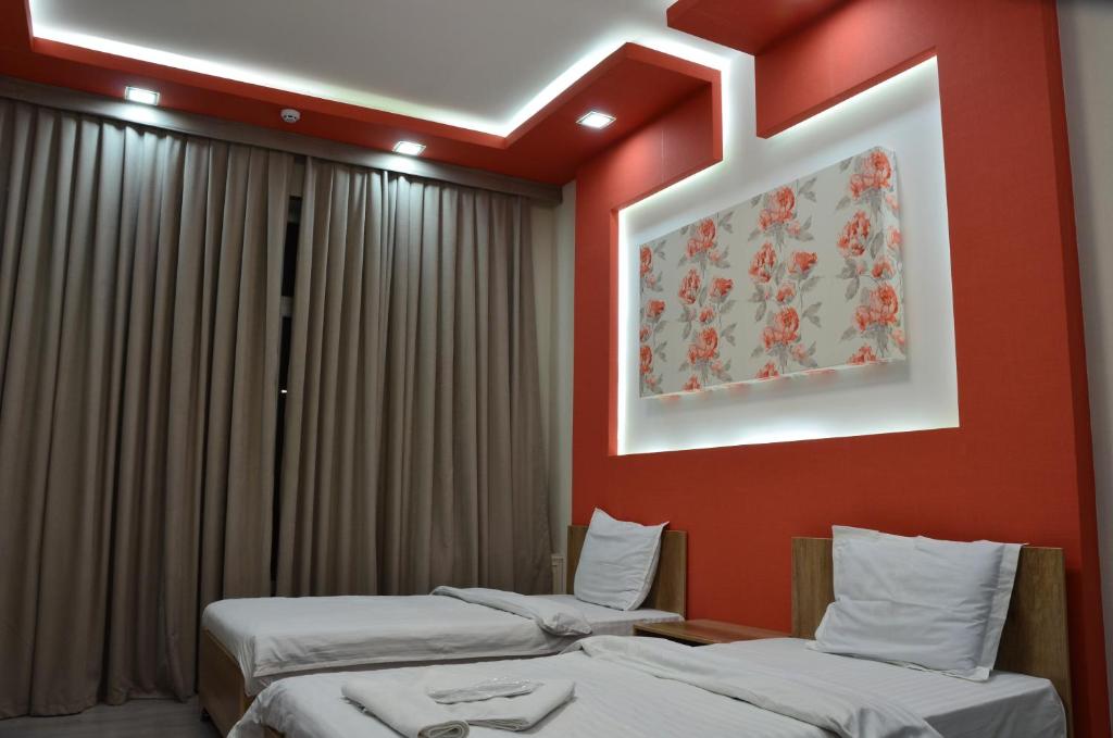 Ένα ή περισσότερα κρεβάτια σε δωμάτιο στο Pearl Tashkent