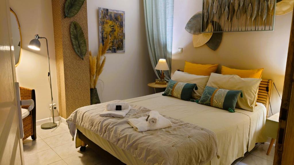 Postel nebo postele na pokoji v ubytování La Maison d 'Isa Mèze appartement RdC