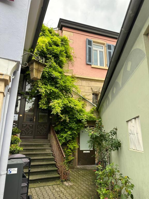 a stairway leading up to a building with plants at bella casa - Business&Family, Messe Flughafen in 5 min, SmartTV, Netflix, Waschmaschine, 24h Checkin, 35qm in Stuttgart