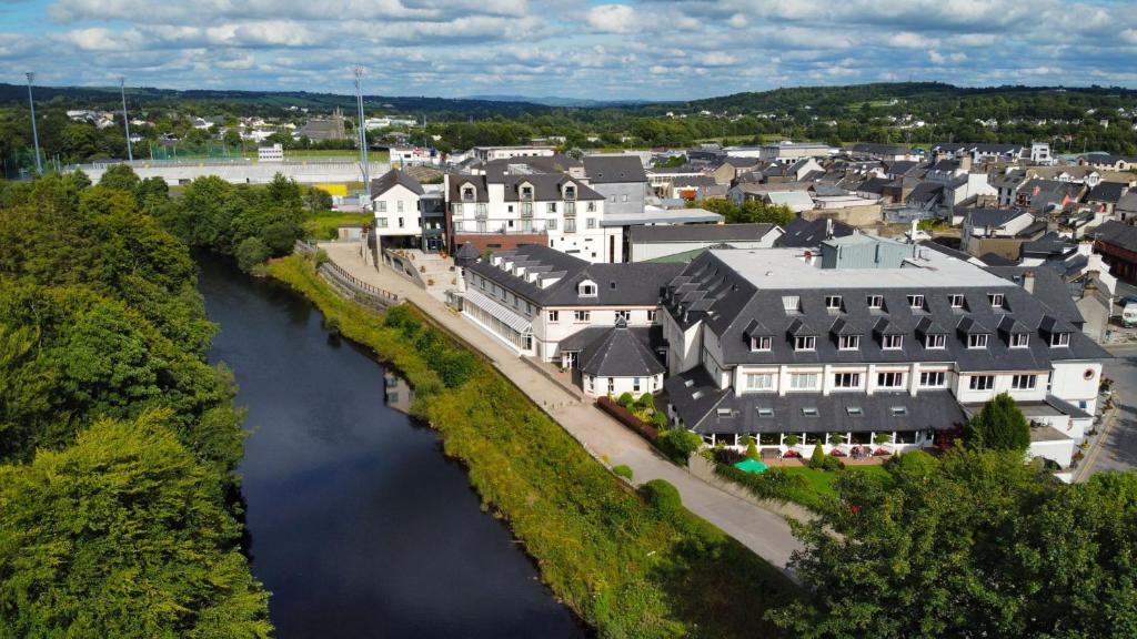 an aerial view of a town next to a river at Jackson's Hotel & Leisure Centre in Ballybofey