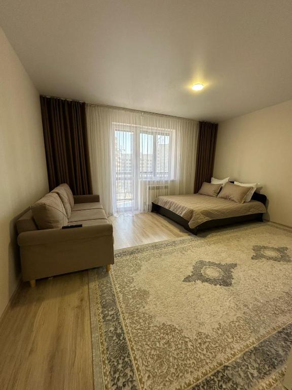 Et opholdsområde på Apartment on Satpayeva