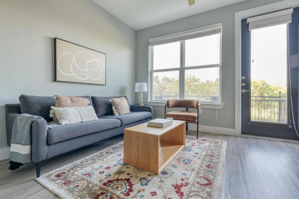 a living room with a couch and a coffee table at Blueground Austin pool nr Walnut Creek ATX-258 in Austin