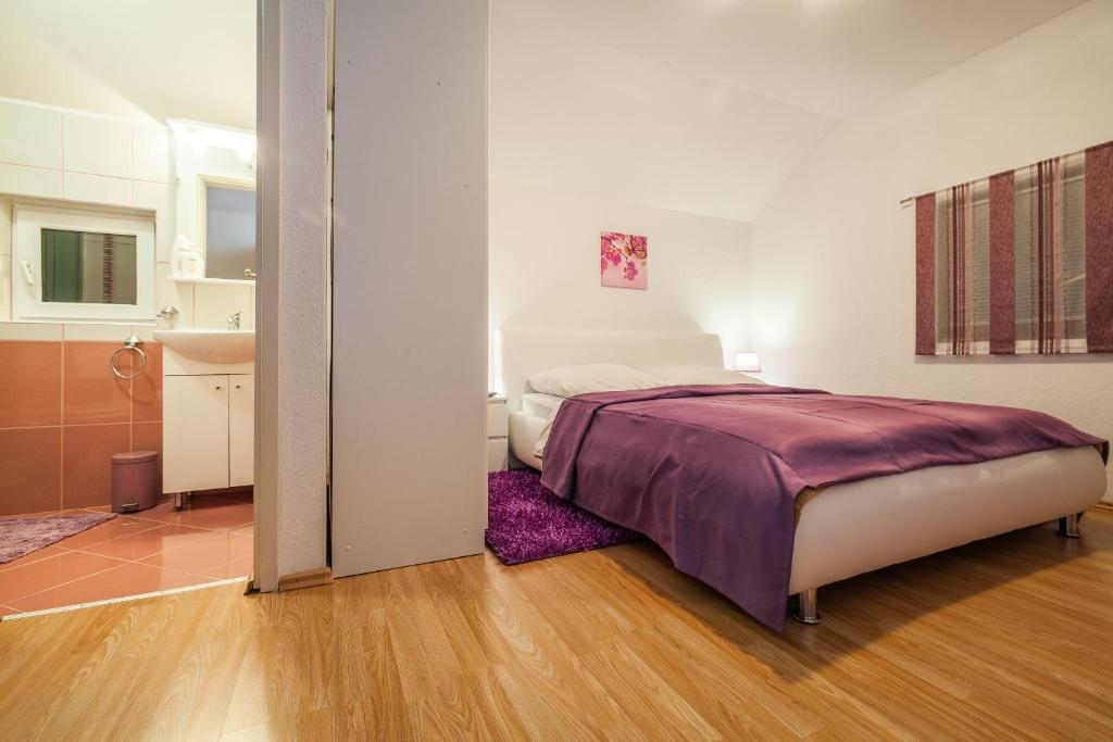 Posteľ alebo postele v izbe v ubytovaní Guest House Slavica