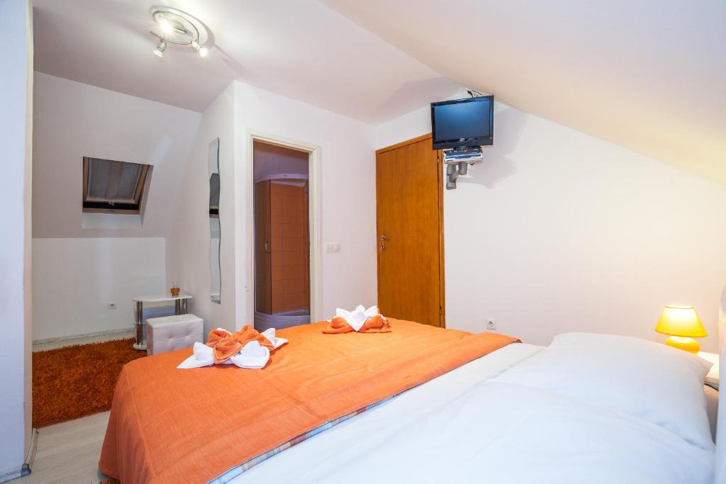 Posteľ alebo postele v izbe v ubytovaní Guest House Slavica