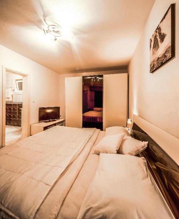 Posteľ alebo postele v izbe v ubytovaní Guest House Slavica