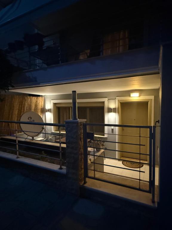 a view of the balcony of a house at night at Fresh Escape in Néa Péramos
