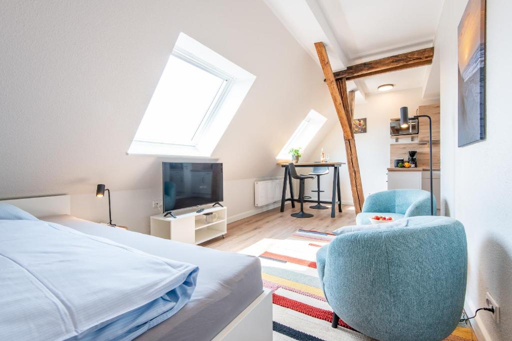 a bedroom with a bed and a tv at Steger-Hüs Wohnung 42 in Rantum