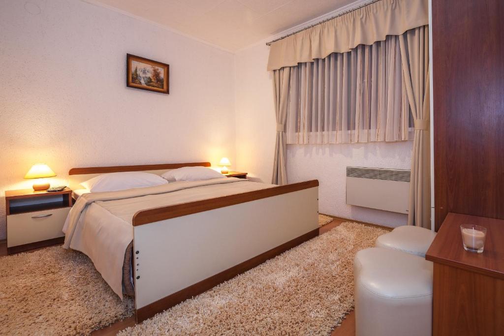 Posteľ alebo postele v izbe v ubytovaní Guest House Slavica
