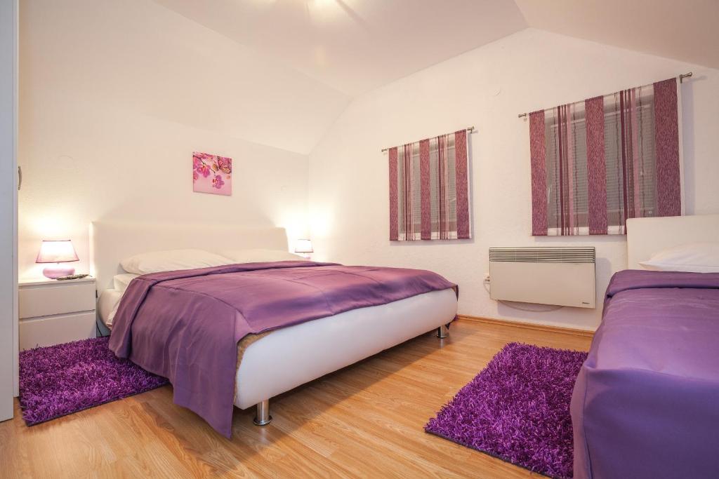 Posteľ alebo postele v izbe v ubytovaní Guest House Slavica