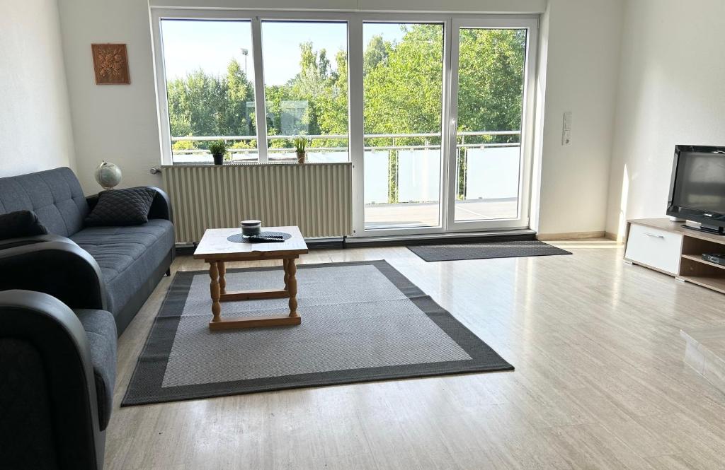 a living room with a couch and a coffee table at Ferienwohnung Birke in Sankt Wendel