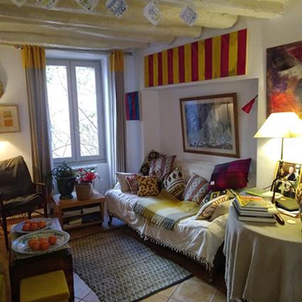 a living room with a couch and a table at 2 Rue de la Tour in Aniane
