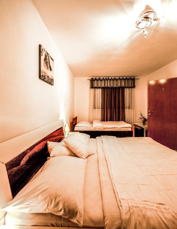 Posteľ alebo postele v izbe v ubytovaní Guest House Slavica