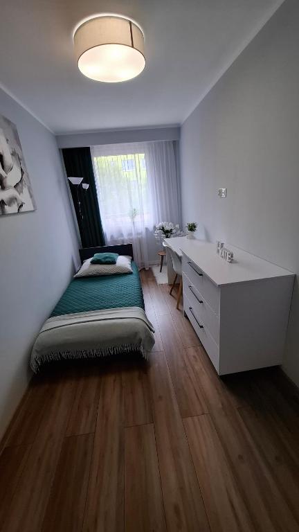 Postel nebo postele na pokoji v ubytování Zielony Makusz