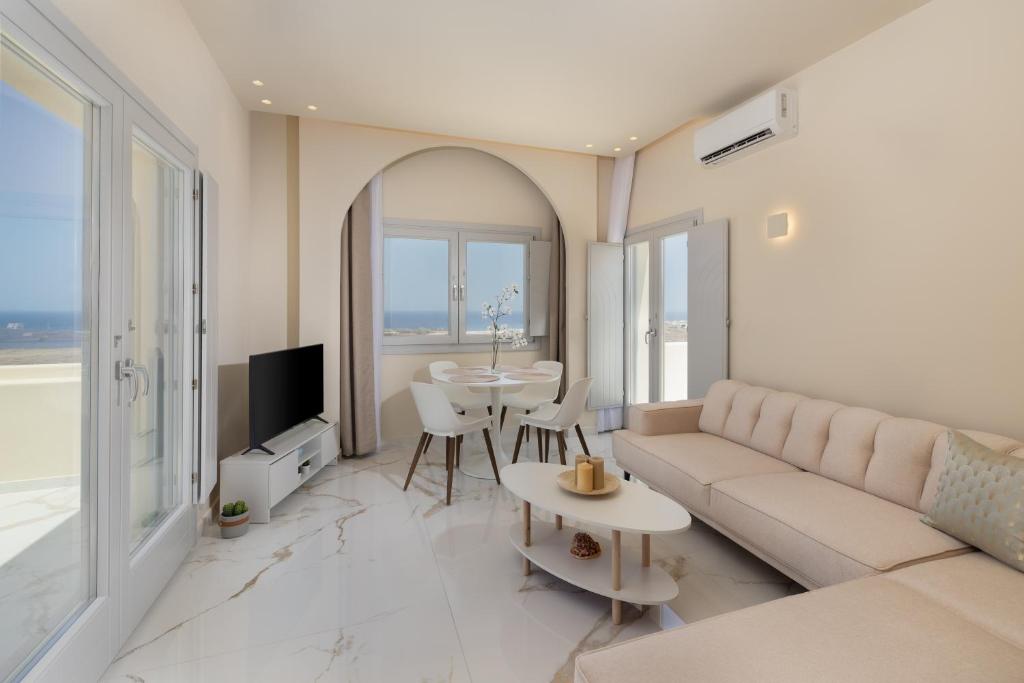 a living room with a couch and a table at Azure Escape in Karterados