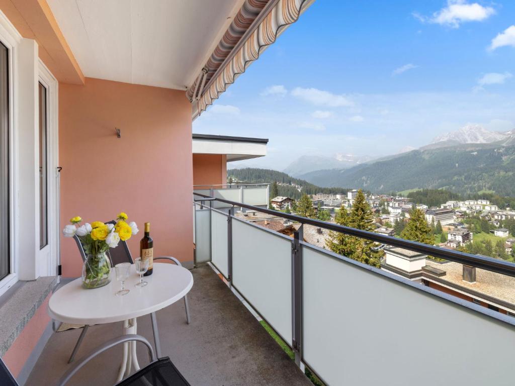 a balcony with a table and a view at Apartment Promenade Apt 407 by Interhome in Arosa