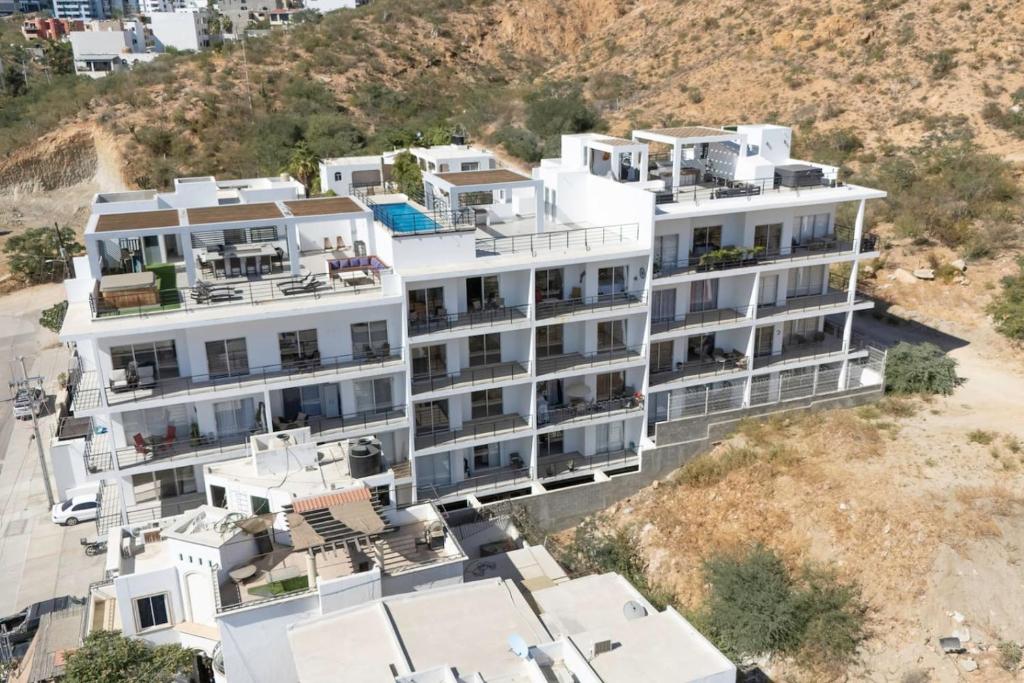 an aerial view of a large white building at 2 BR Wake up to unique views from your balcony in Cabo San Lucas
