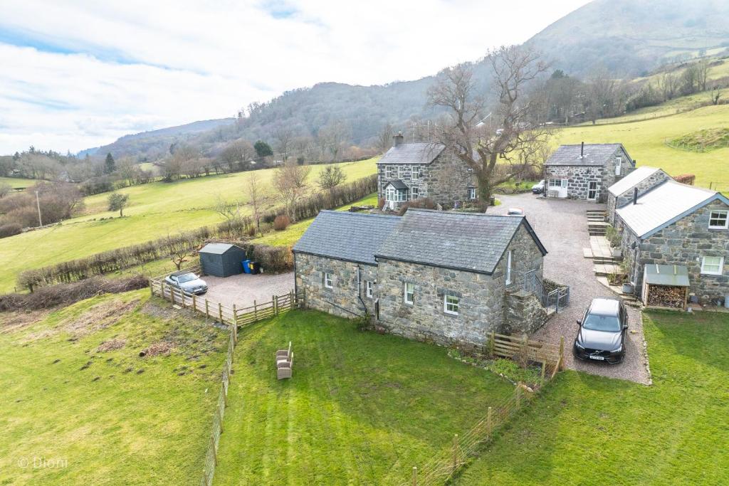 an aerial view of a stone house in a field at The-Byre in Llanbedr-y-cennin