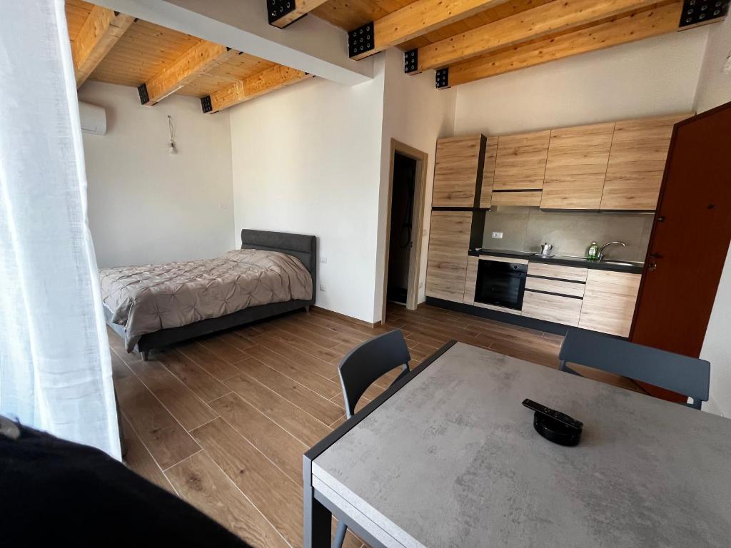 a room with a table and a bed and a kitchen at CAMPING VILLAGE Orsa Minore in Campo di Giove