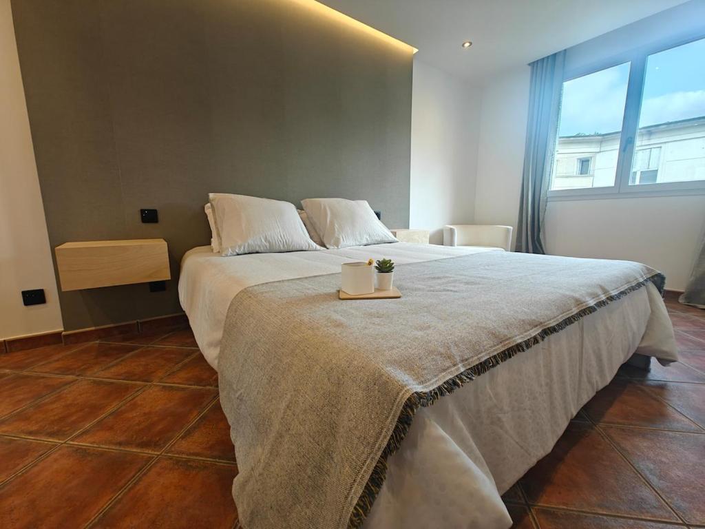 a bedroom with a large bed with a table on it at Premium Apartment in Antigone Luxury and comfort in Montpellier