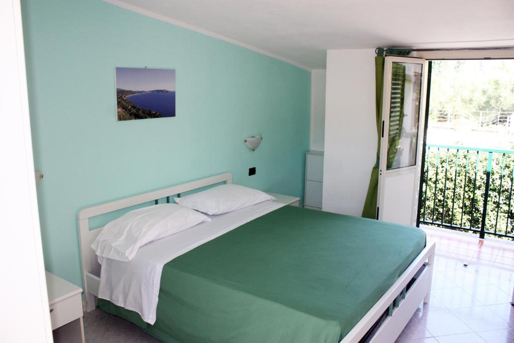 Postel nebo postele na pokoji v ubytování Hotel Ulisse