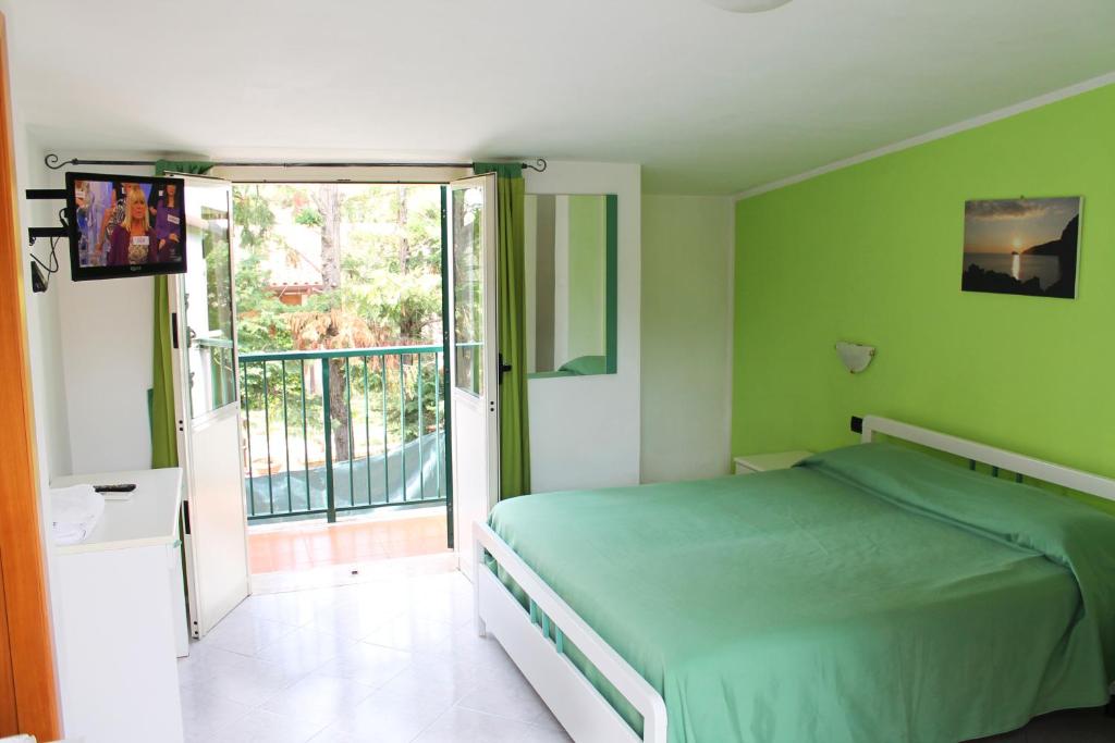 Postel nebo postele na pokoji v ubytování Hotel Ulisse