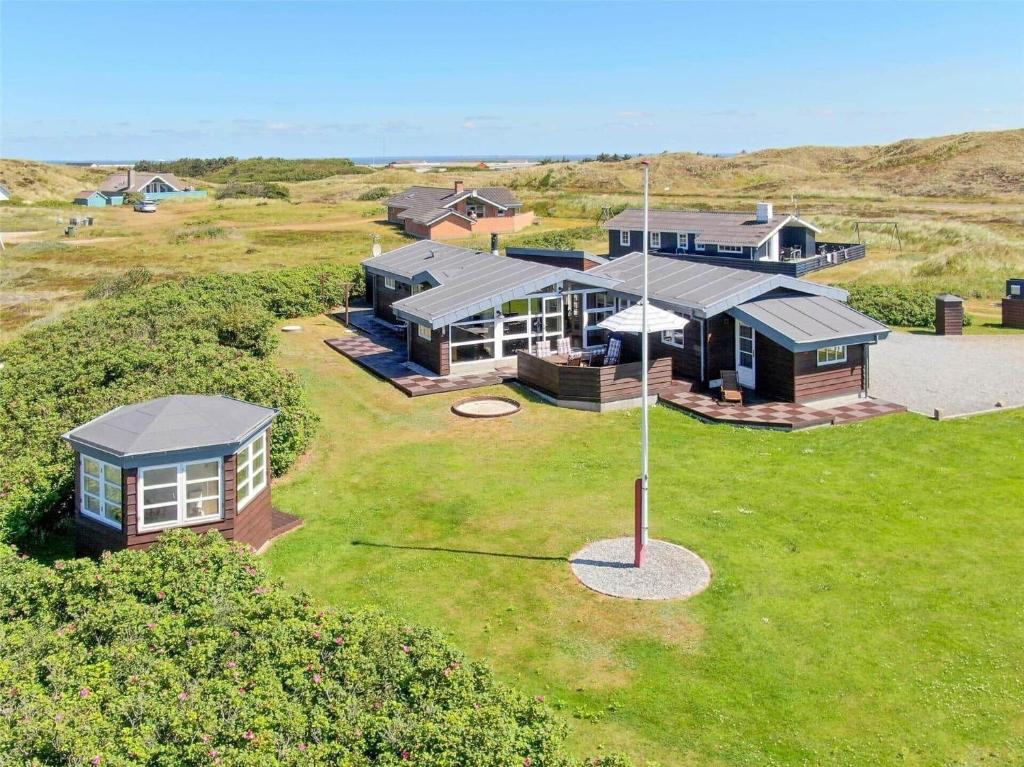 an aerial view of a house with a golf course at 439-Hvide-Sande-Tingodden-120 in Hvide Sande