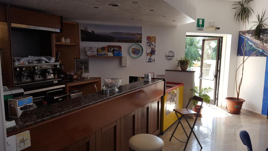 Kuchyň nebo kuchyňský kout v ubytování Hotel Ulisse