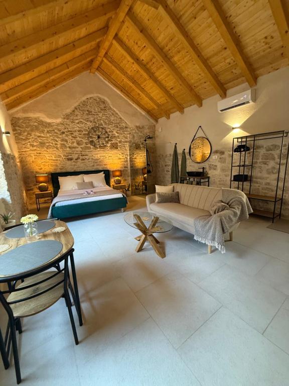 a bedroom with a bed and a table at The Hideaway - Kastel Novi in Kaštela