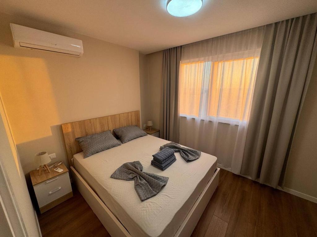 Ένα ή περισσότερα κρεβάτια σε δωμάτιο στο Pure Pebble Apartment By Adriatic Living
