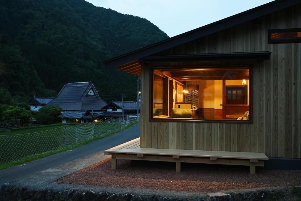 a small house with a large window on a street at Nantan - House - Vacation STAY 82583v in Ōno