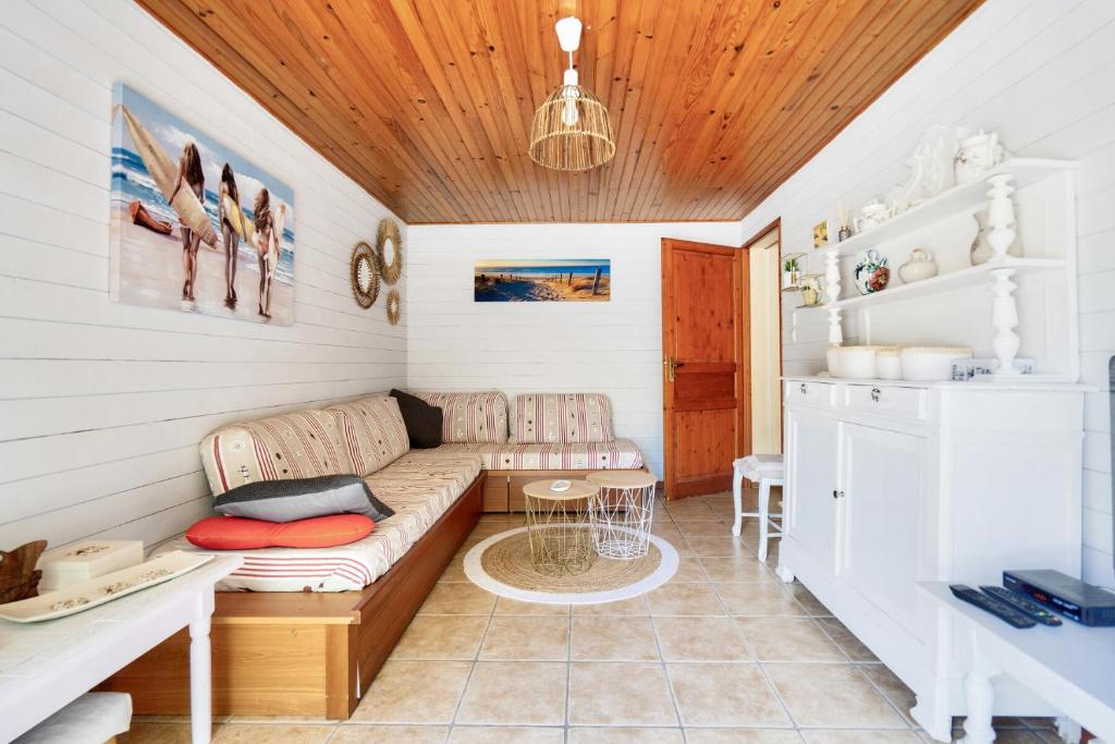a living room with a couch and a table at Maison de campagne - maeva home - Maison 4 pièces 6 personnes - Confort MAE-7261 in Carcans