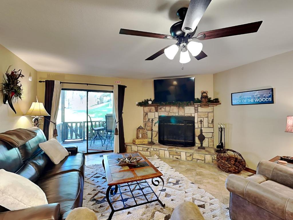 a living room with a couch and a ceiling fan at Innsbrook 254 in Ruidoso