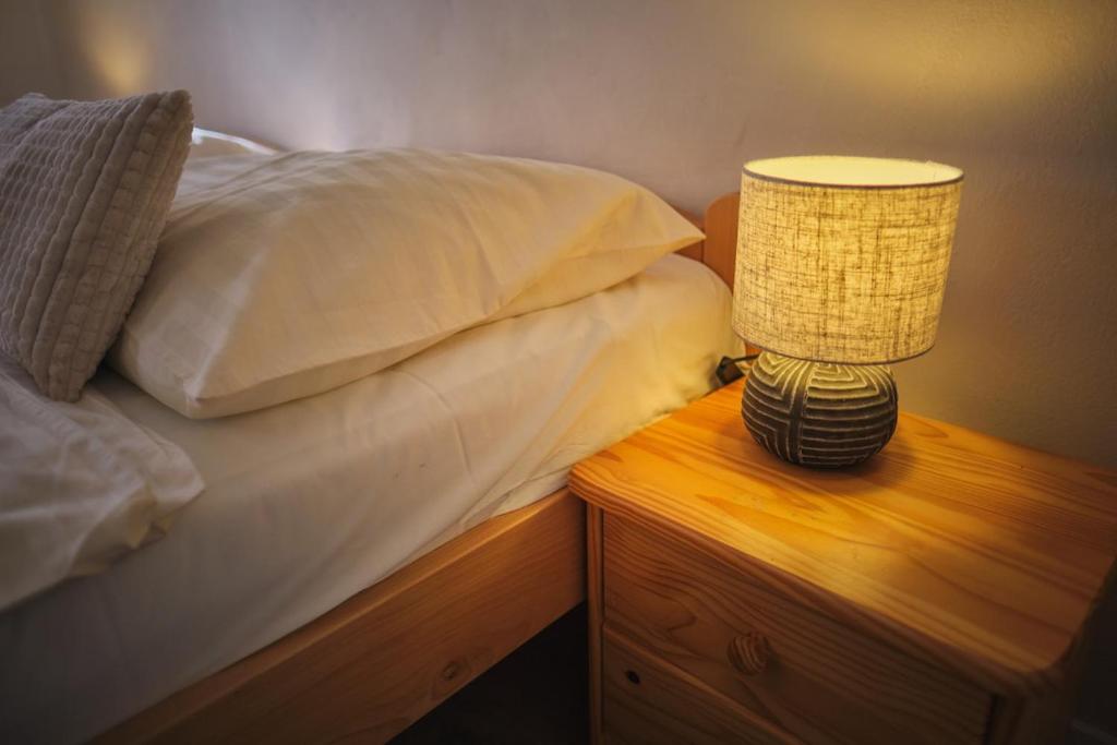 Ένα ή περισσότερα κρεβάτια σε δωμάτιο στο vila Barbara - Vysoké Tatry