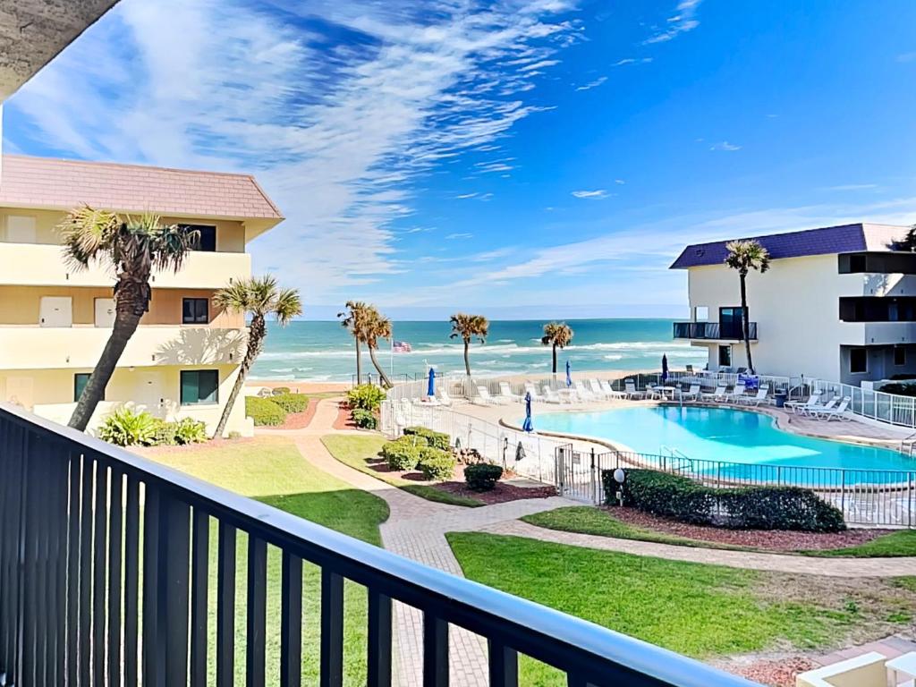 a view of the ocean from the balcony of a resort at Bent Palm 218 in Ormond Beach